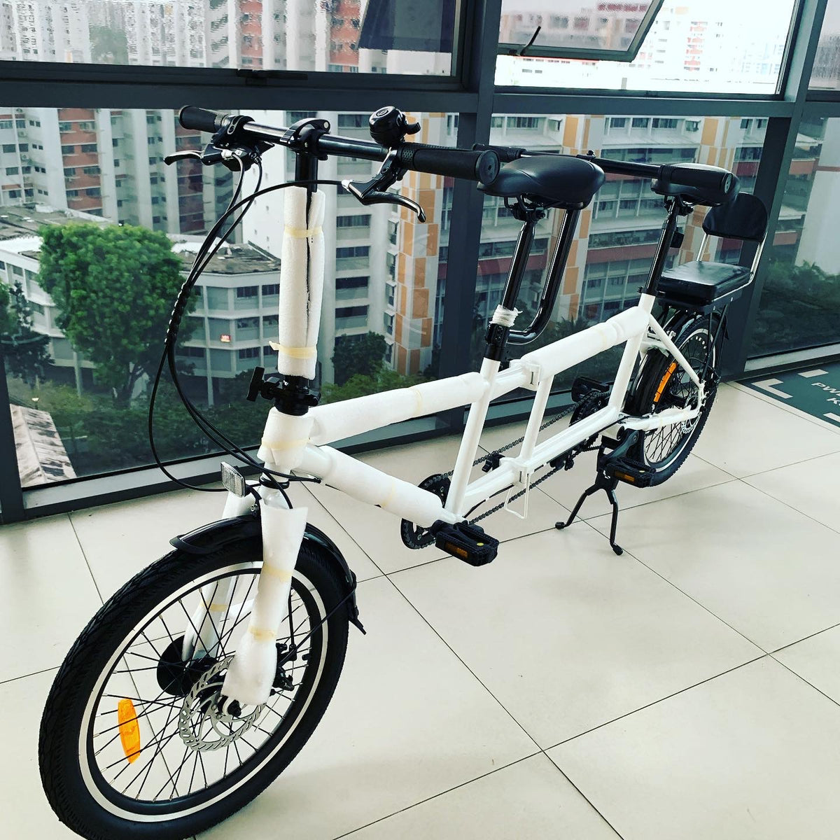 Electric folding tandem store bike